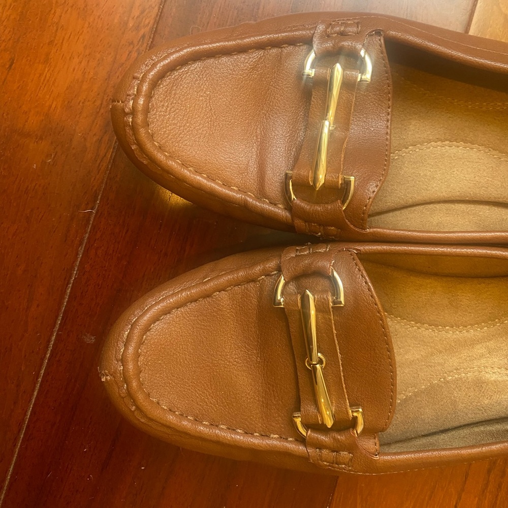 Brown loafers with gold hardware